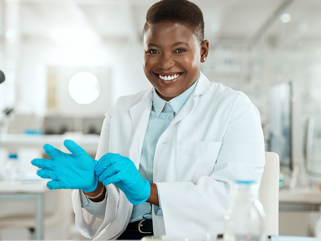 Person in laboratory with gloves